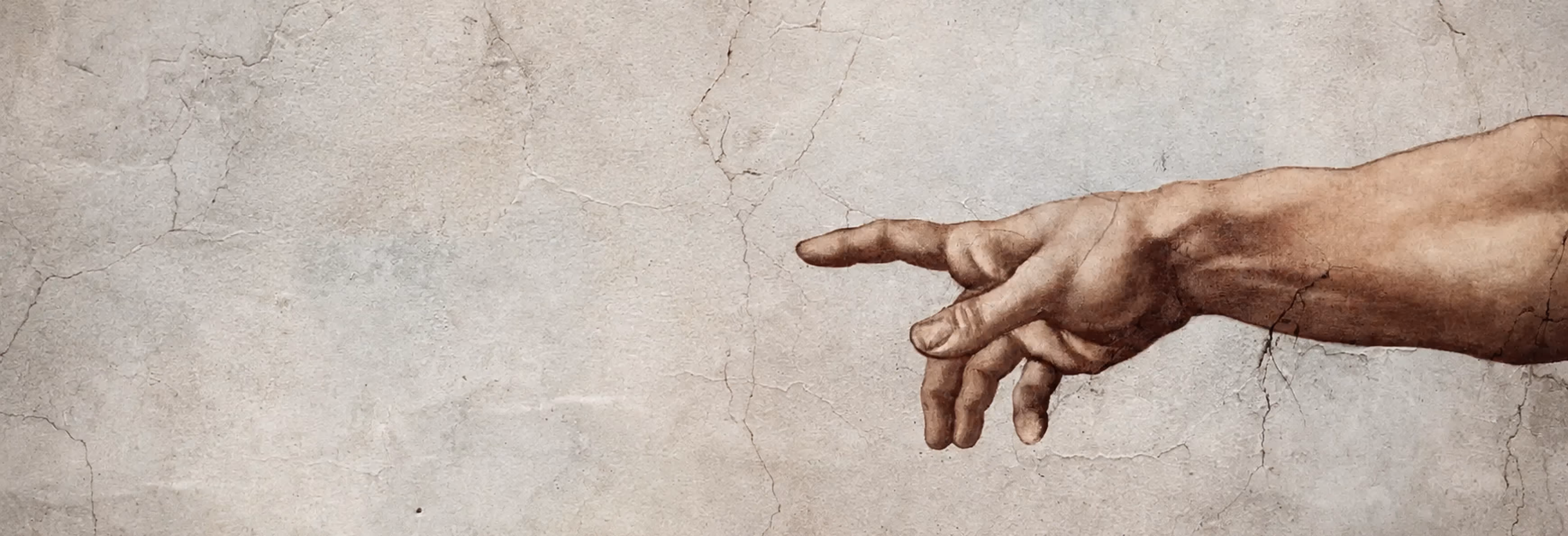 Detail of Michelangelo’s The Creation of Adam, showing Adam’s outstretched arm.